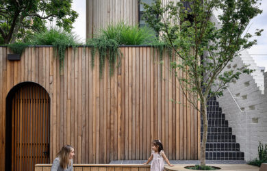 Vertical timber panelling envelops the rear courtyard, photographed for green magazine issue 91: Lit Up by Derek Swalwell.